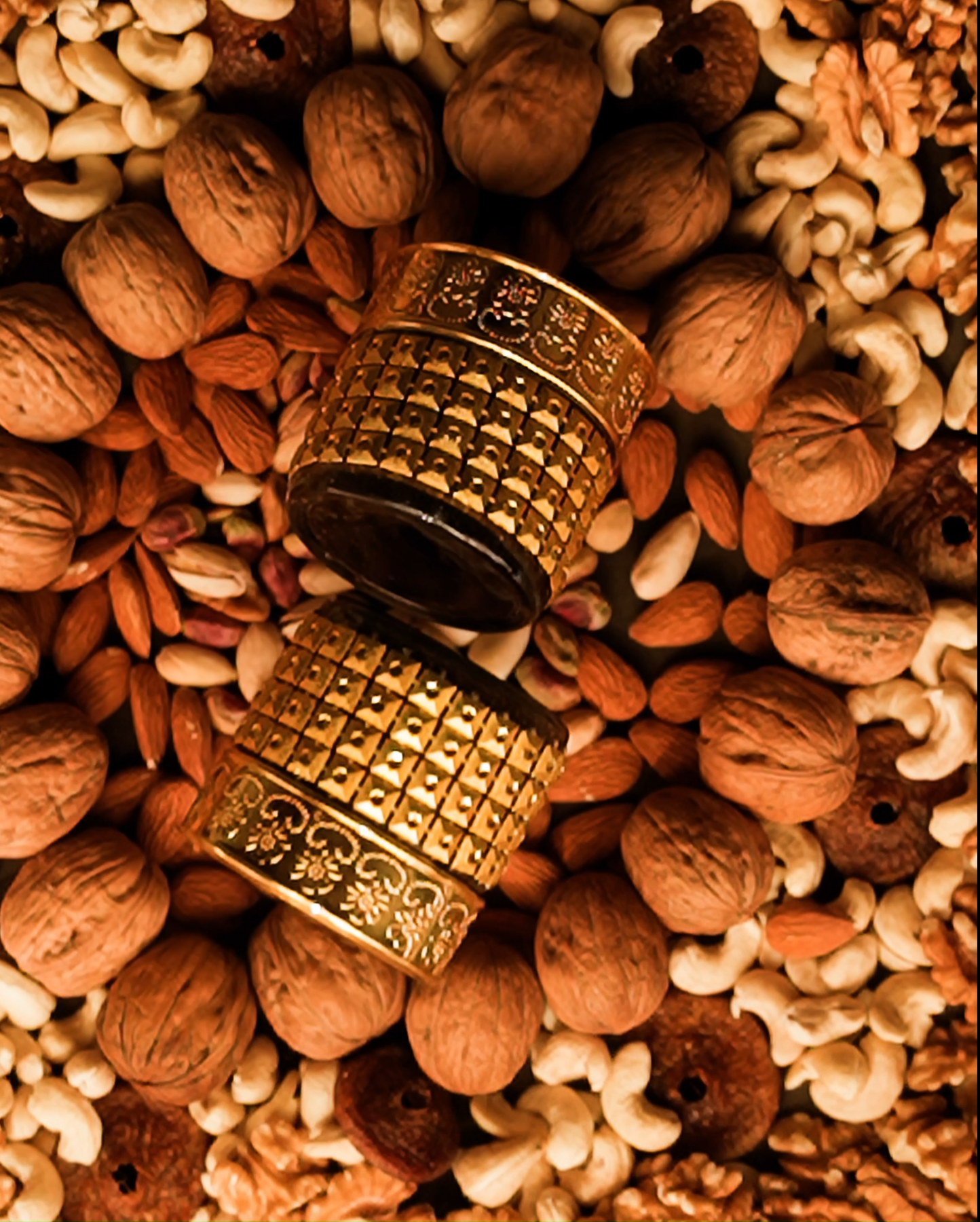 Two bottles of Dr. Herbs Majoon e Khaas surrounded by various ingredients used in the product